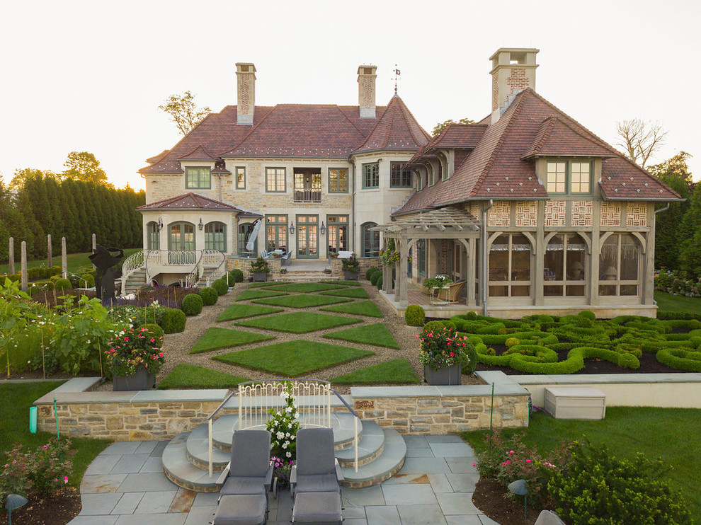 Inspiration for a huge traditional full sun front yard gravel formal garden in Other for spring.