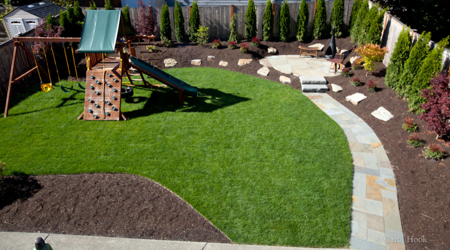 Inspiration for a medium sized traditional back full sun garden in Seattle with natural stone paving.