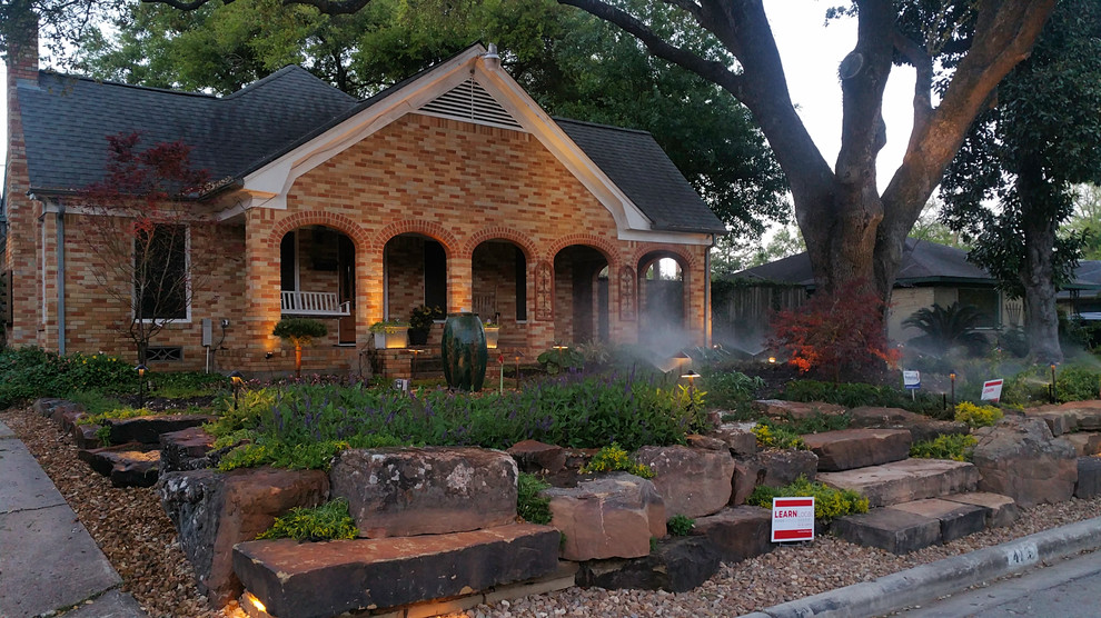 This is an example of a large southwestern front yard landscaping in Houston.
