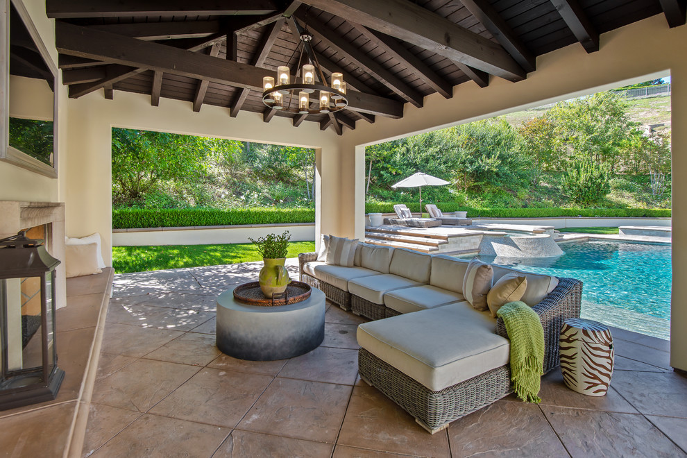 This is an example of a large contemporary back patio in San Diego with concrete paving.