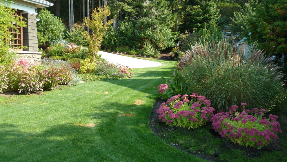 This is an example of a mid-sized traditional shade side yard formal garden in Seattle for summer.