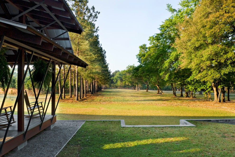 Photo of a huge farmhouse backyard landscaping in Charleston.