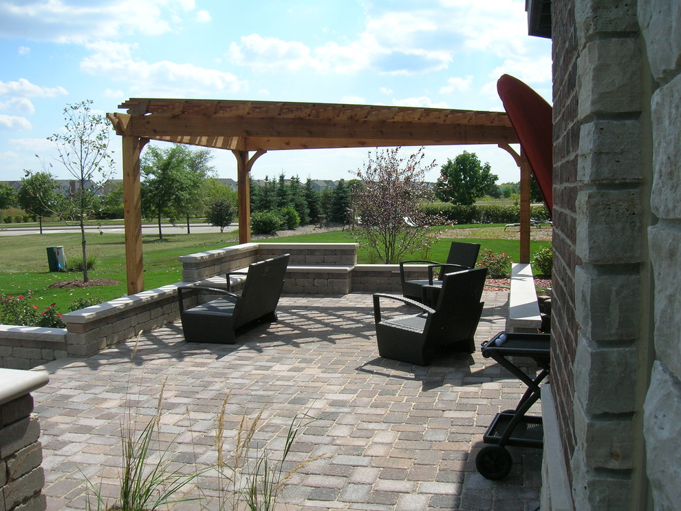 Brick Patio, Seat Wall and Pergola Transitional Patio Chicago