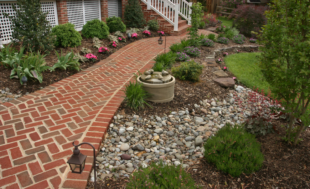 Inspiration for a medium sized classic side full sun garden in DC Metro with a garden path and brick paving.