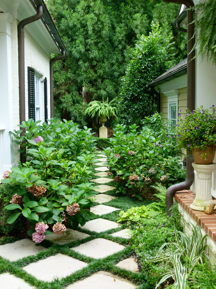 Inspiration for a traditional full sun concrete paver garden path in Atlanta.