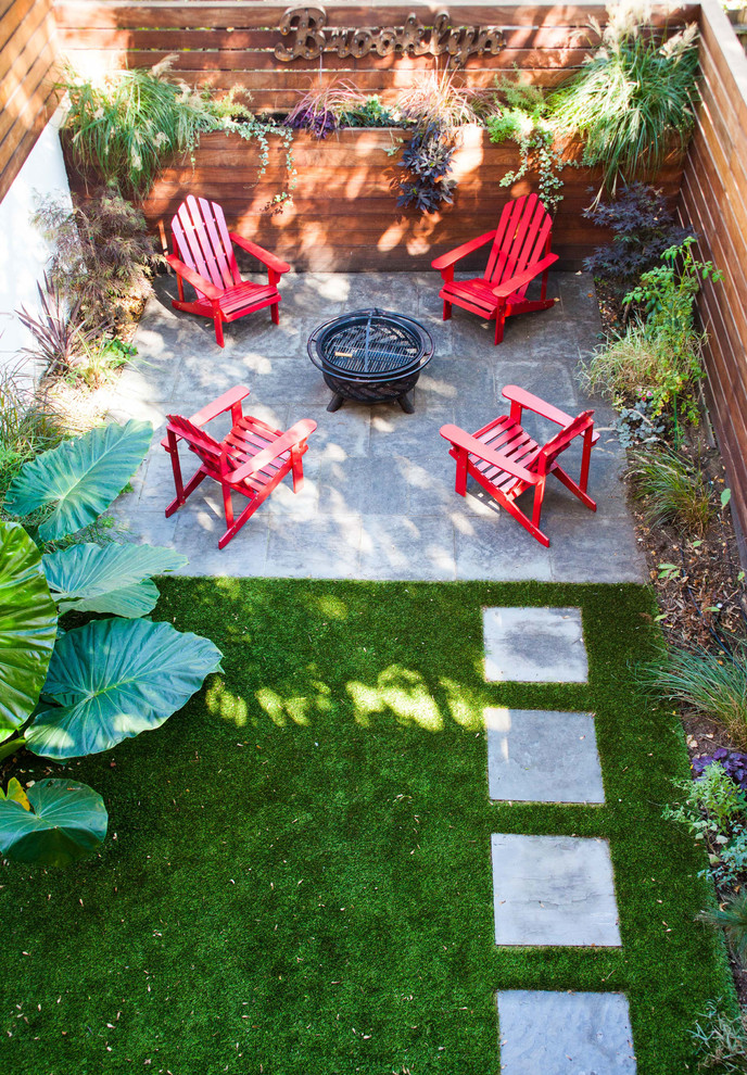 Photo of a mid-sized partial sun backyard landscaping in New York.