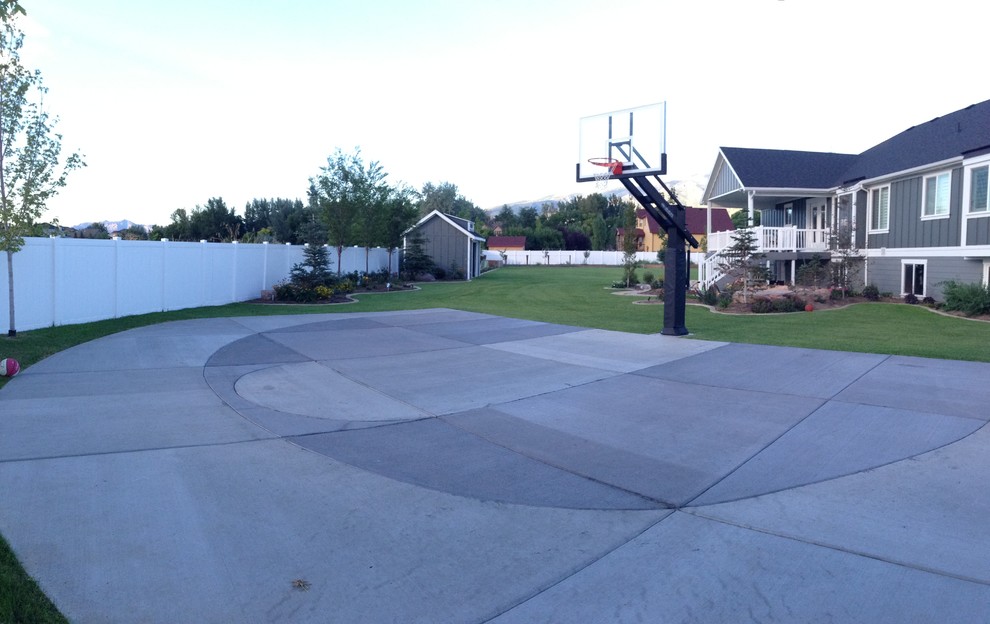 Photo of a large classic front full sun garden in Salt Lake City with an outdoor sport court.