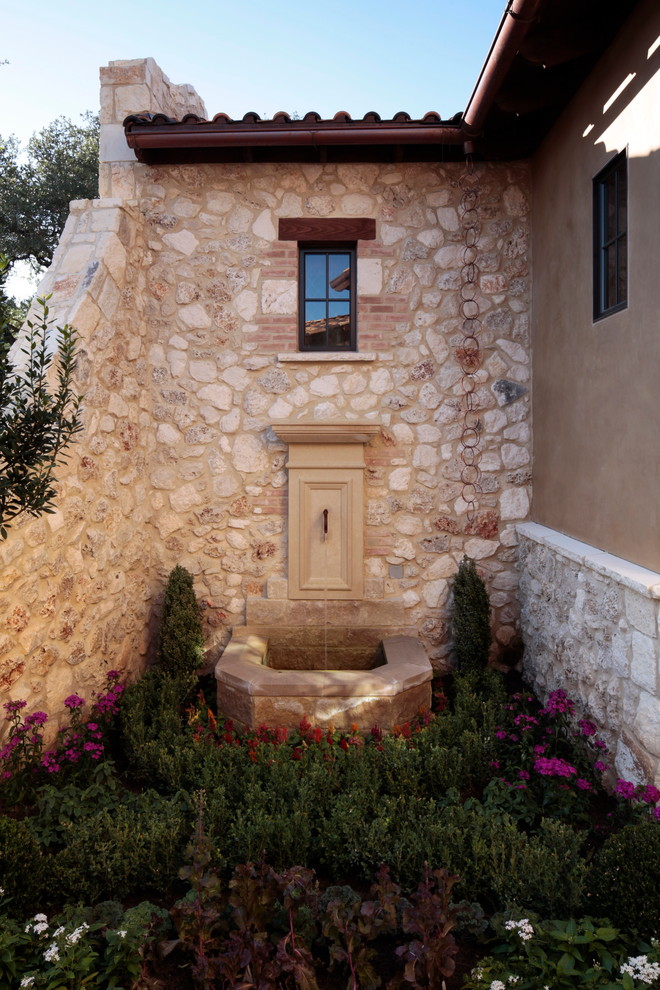 Inspiration for a mediterranean garden in Austin with a vegetable patch.