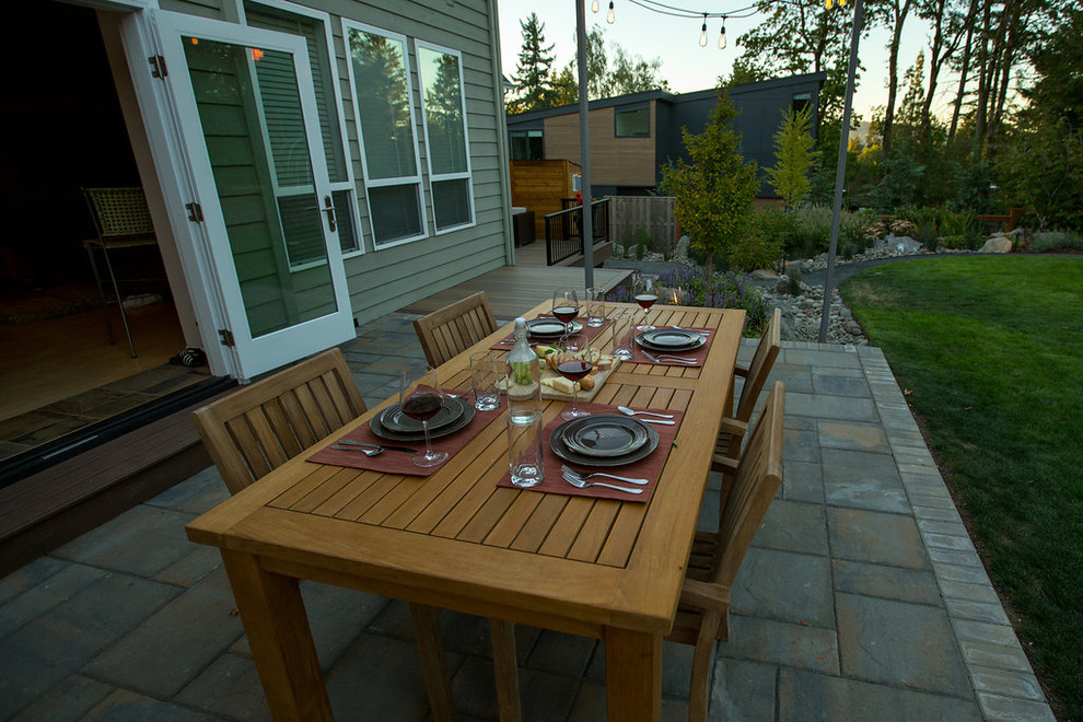 This is an example of a large contemporary back full sun garden in Portland.