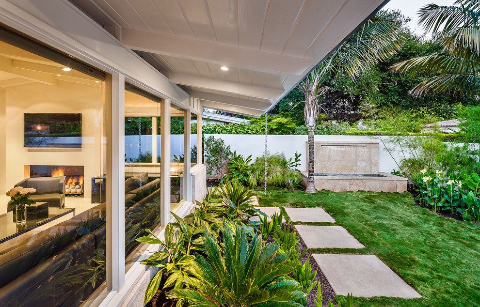 Design ideas for a mid-sized mid-century modern shade backyard landscaping in Santa Barbara.