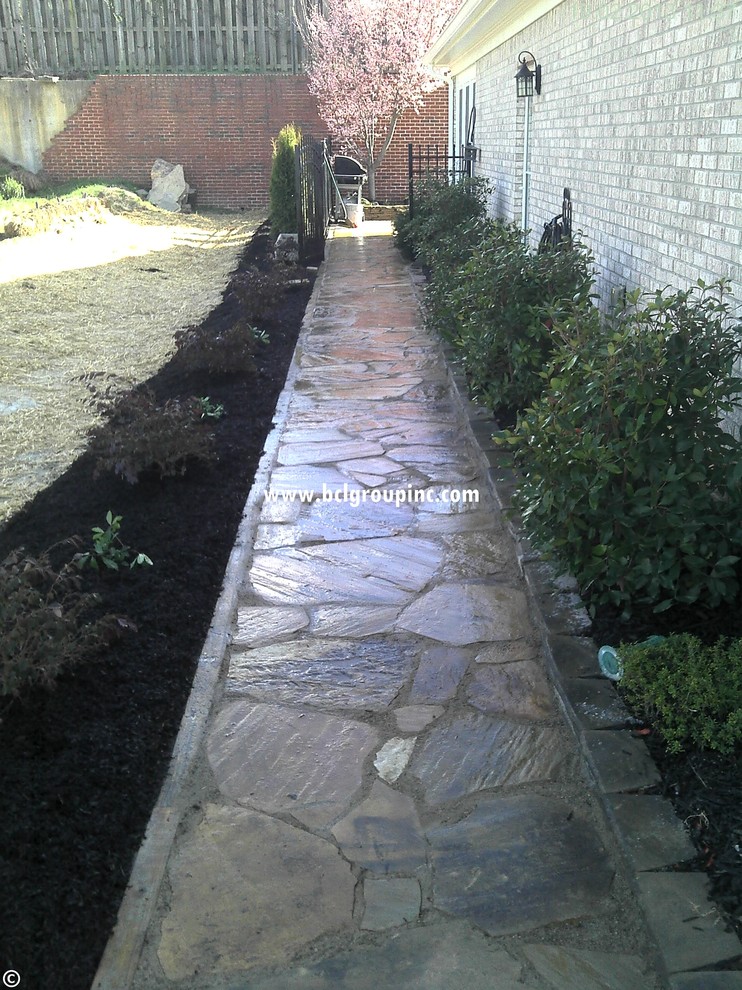 Photo of a mid-sized traditional front yard landscaping in Atlanta.