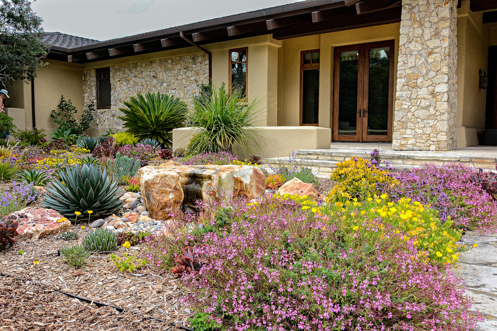 Inspiration for a small mediterranean drought-tolerant and partial sun front yard mulch landscaping in San Diego for summer.