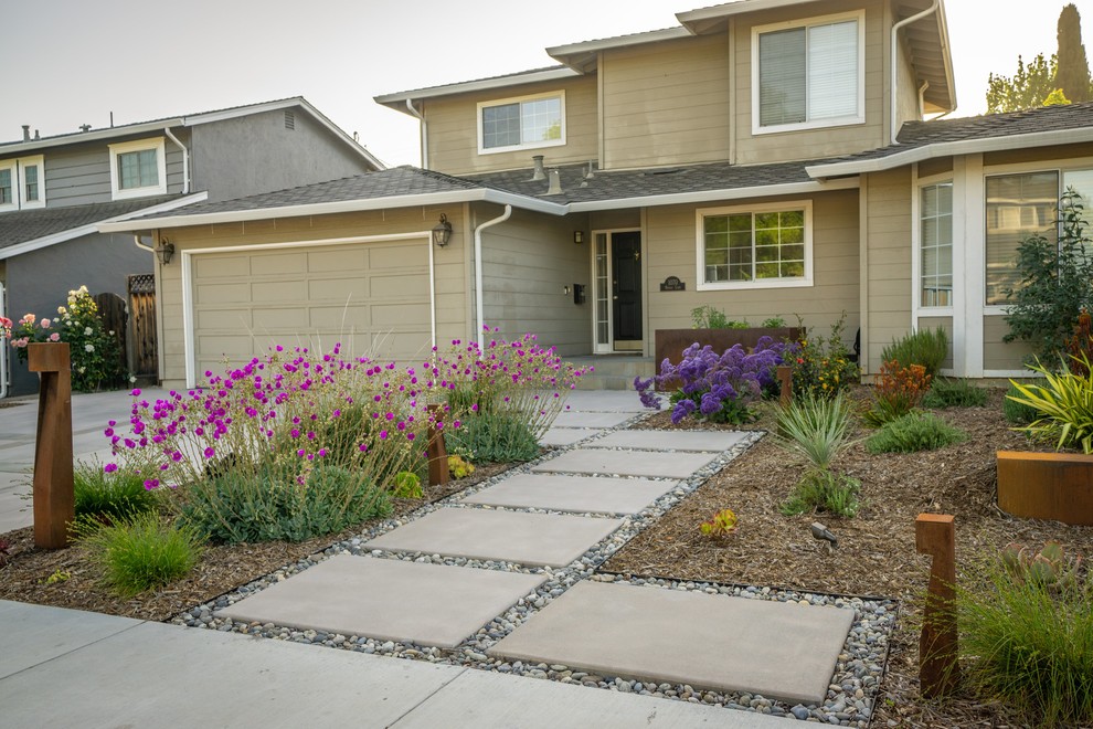 Photo of a mid-sized modern drought-tolerant front yard concrete paver landscaping in San Francisco.