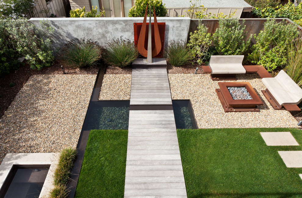 Design ideas for a mid-sized contemporary drought-tolerant backyard concrete paver pond in San Francisco.