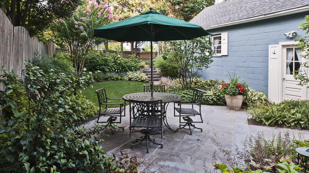 Photo of a medium sized classic back patio in DC Metro with natural stone paving.