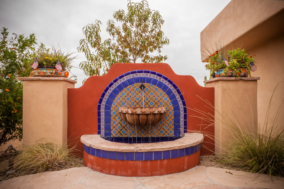 Back full sun garden in Phoenix with a water feature.