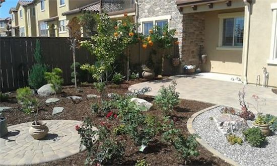 Photo of a mid-sized southwestern backyard brick landscaping in San Diego.