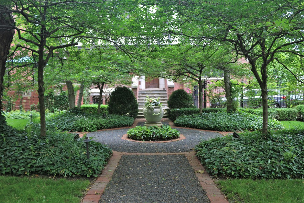Photo of a medium sized traditional courtyard formal fully shaded garden for summer in Chicago with a garden path and gravel.