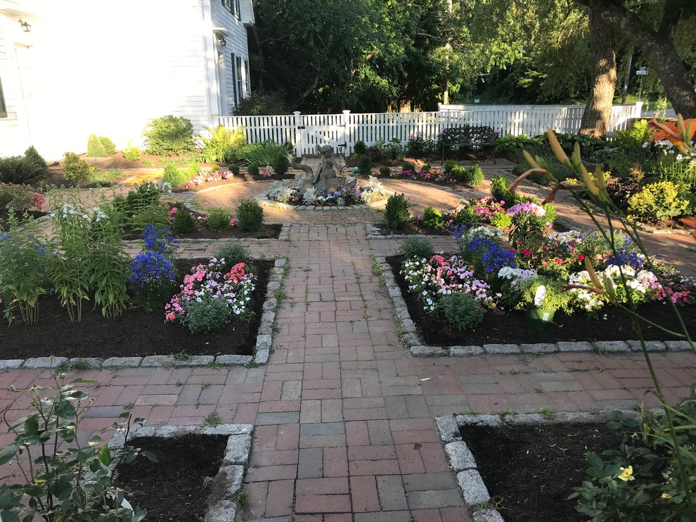 Design ideas for a small traditional partial sun courtyard formal garden in Boston.