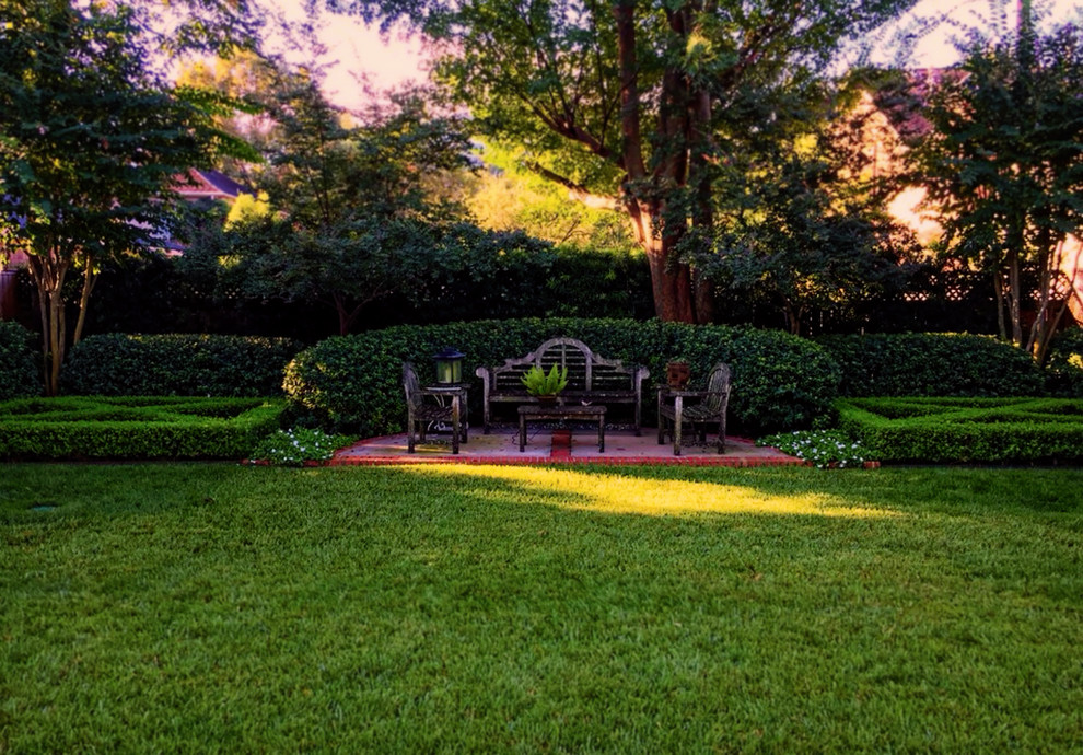Design ideas for a traditional full sun backyard formal garden in Houston with decking.