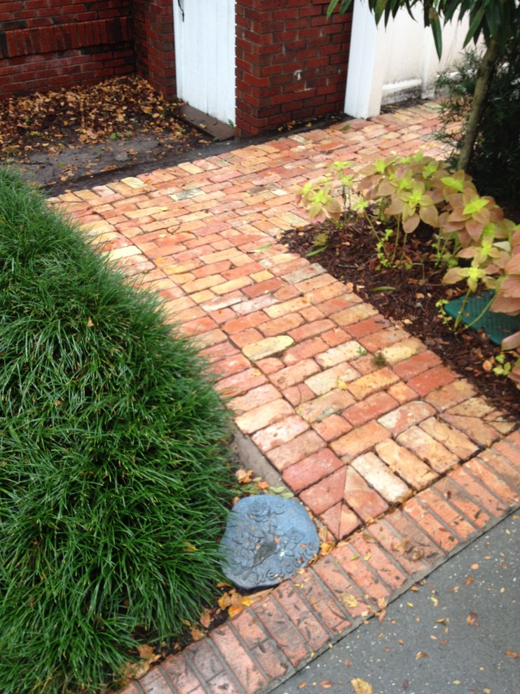 Design ideas for a medium sized classic side garden in Tampa with brick paving.