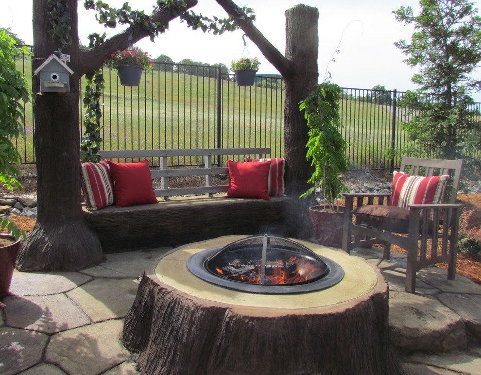 Inspiration for a traditional back patio in New York with a fire feature.