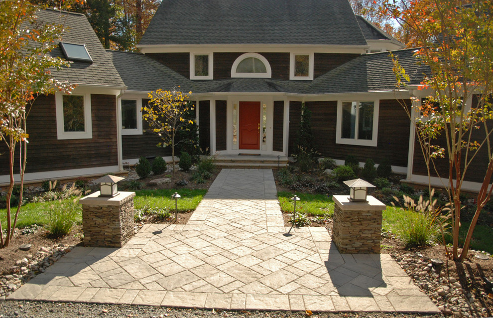 Medium sized contemporary front full sun garden for autumn in DC Metro with concrete paving.