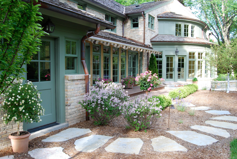 Traditional garden for summer in Milwaukee with natural stone paving.