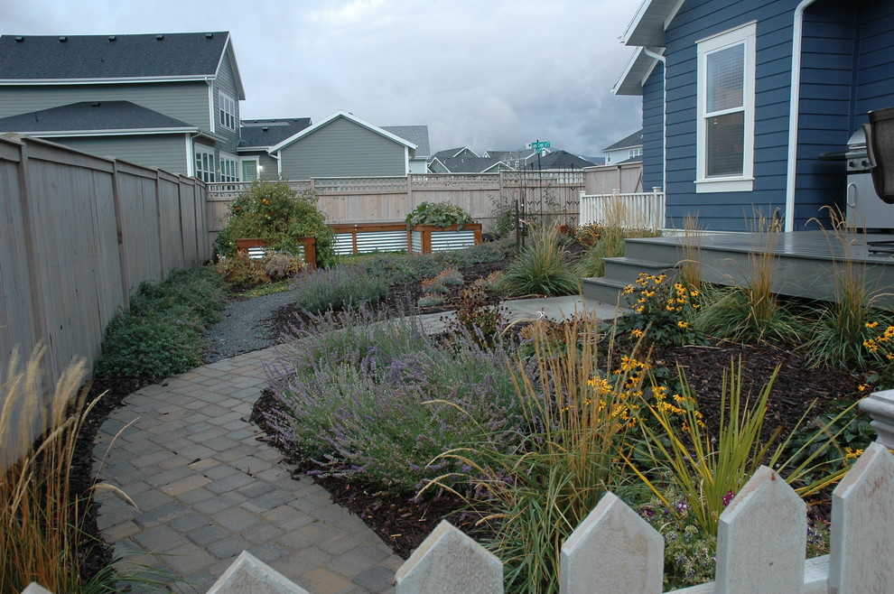 This is an example of a mid-sized contemporary drought-tolerant and full sun backyard stone vegetable garden landscape in Salt Lake City for fall.
