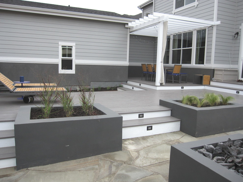Design ideas for a contemporary backyard landscaping in Denver with decking.
