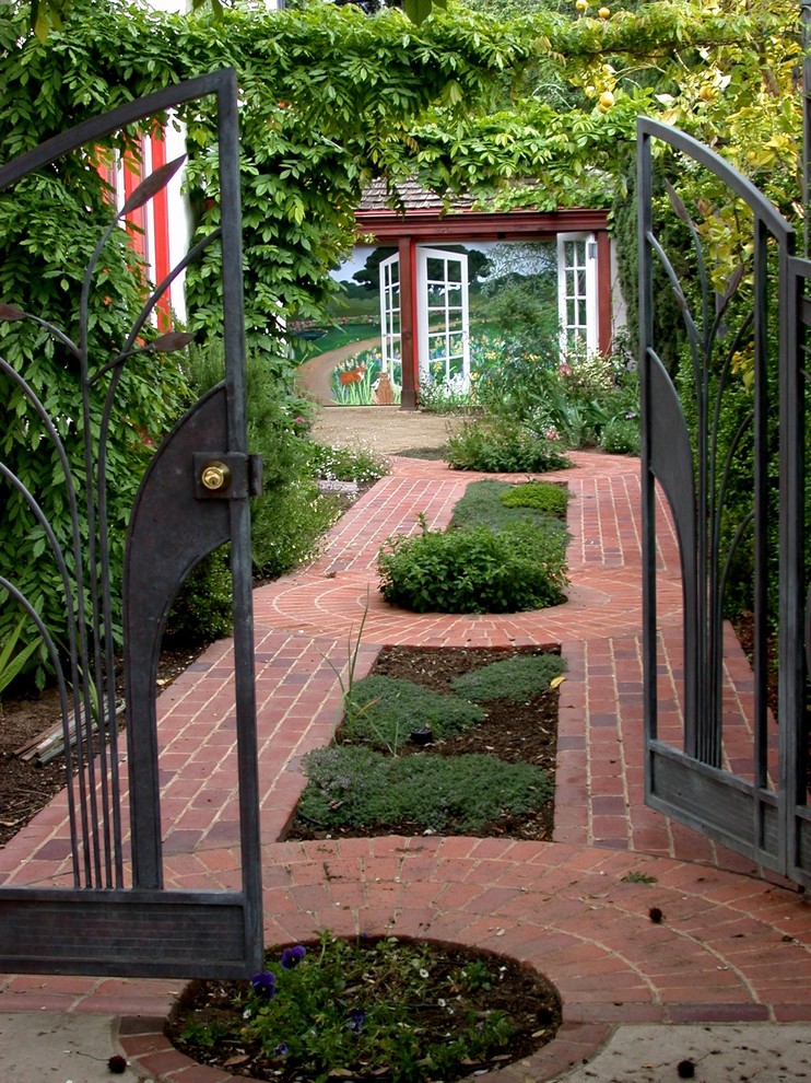 This is an example of a small classic side driveway garden in San Francisco with brick paving.