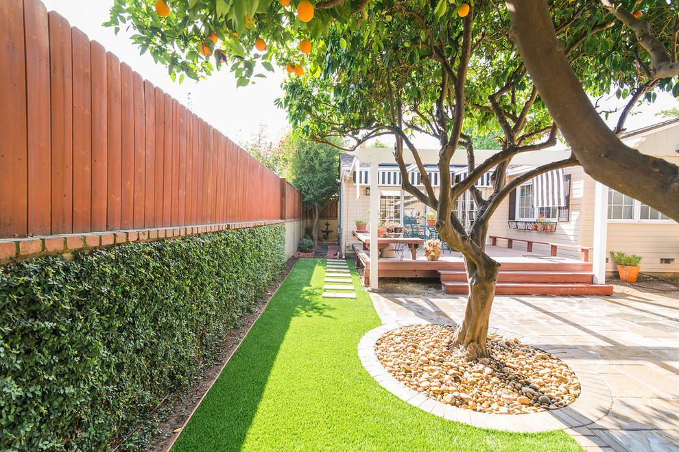 Design ideas for a small modern partial sun backyard concrete paver formal garden in Los Angeles for spring.
