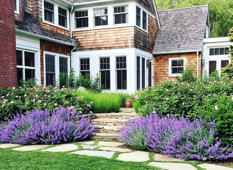 Inspiration for a large classic back formal partial sun garden for summer in New York with a garden path and concrete paving.
