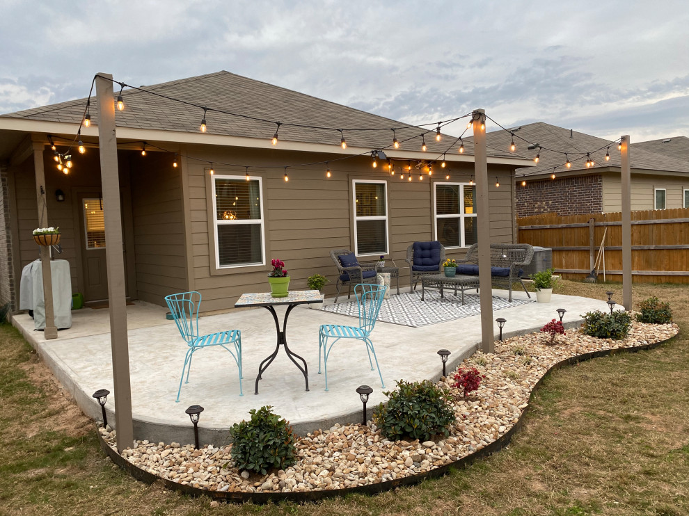 Concrete Patio Extension With A Planterbed And String Lights