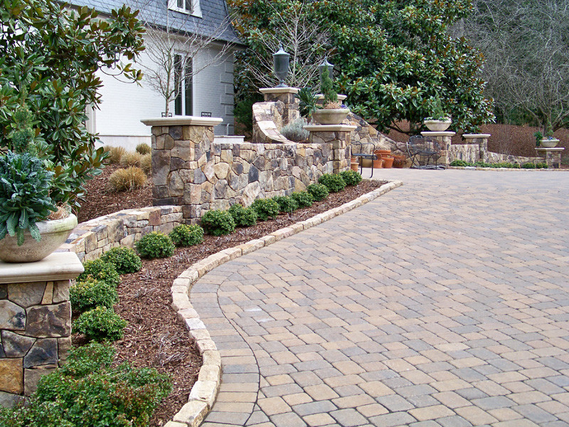 Design ideas for a traditional front yard concrete paver driveway in Other.