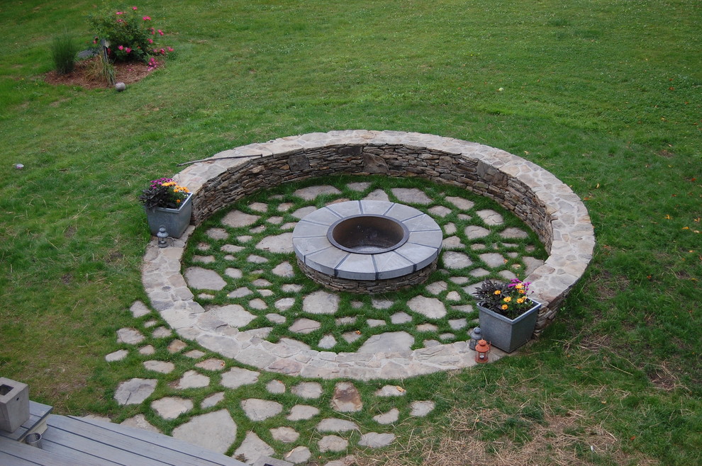 This is an example of a traditional garden in New York with a fire feature.