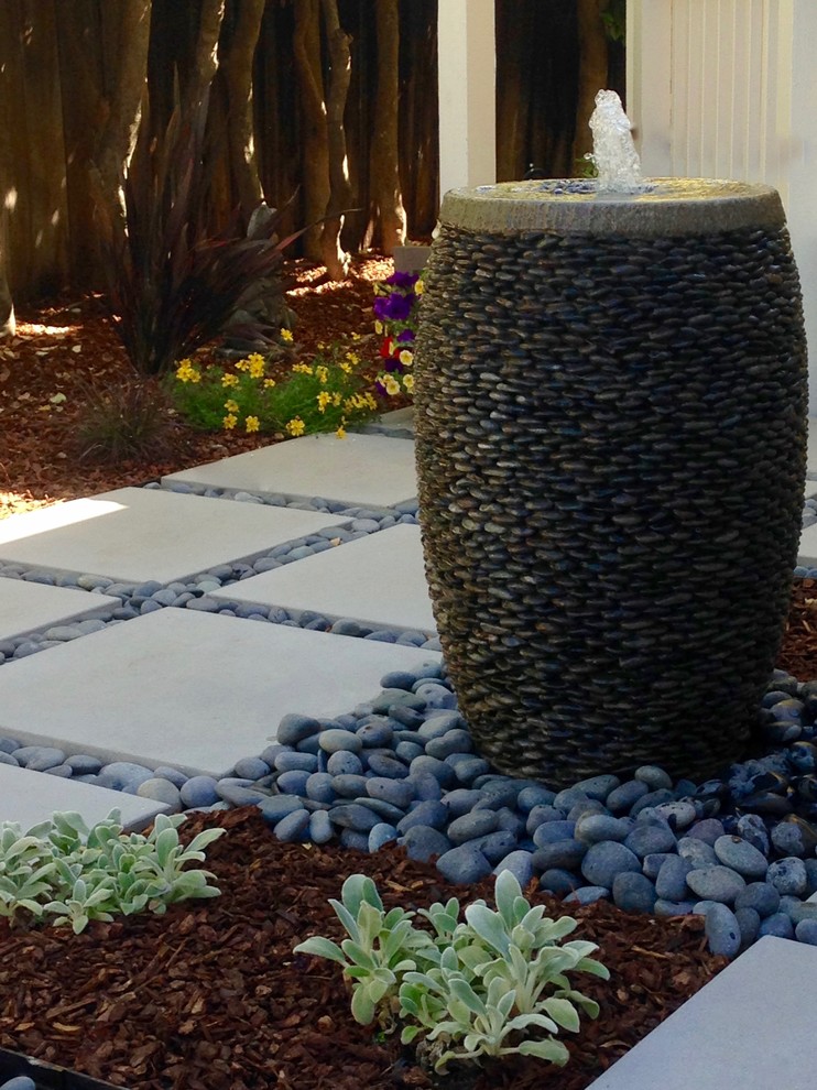 Design ideas for a mid-sized contemporary partial sun backyard concrete paver landscaping in San Francisco for summer.