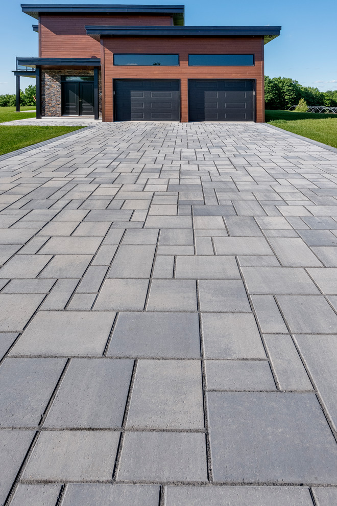 Medium sized contemporary front driveway garden in Other.