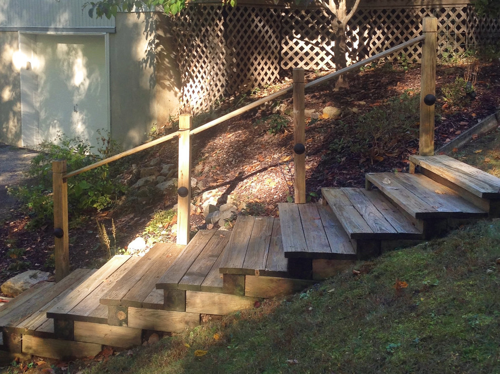 Large contemporary side partial sun garden in New York with a garden path and decking.