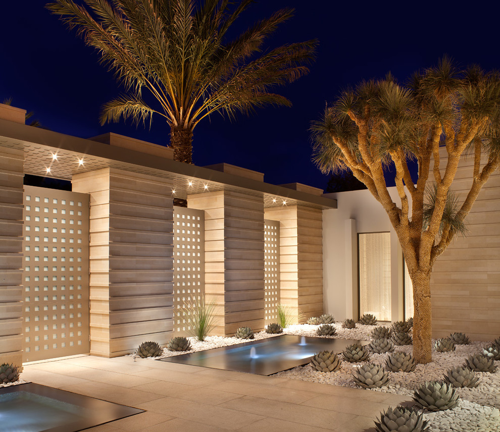 Inspiration for a small contemporary full sun and desert courtyard gravel landscaping in Los Angeles for summer.