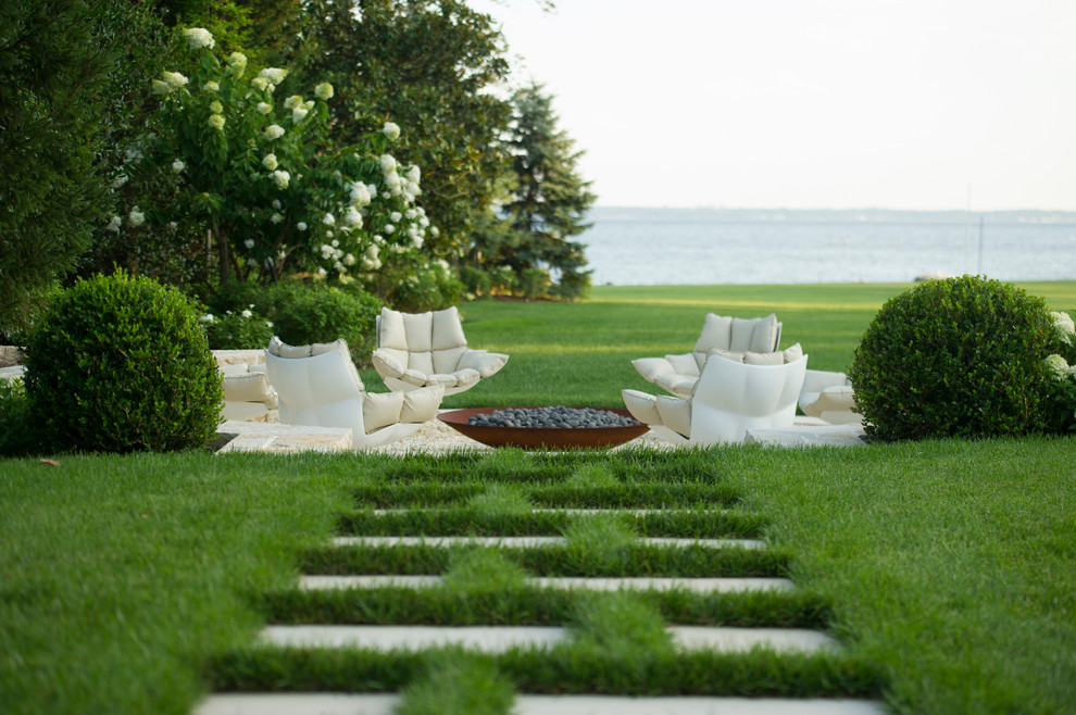 This is an example of a mid-sized contemporary full sun backyard stone garden path in New York for summer.