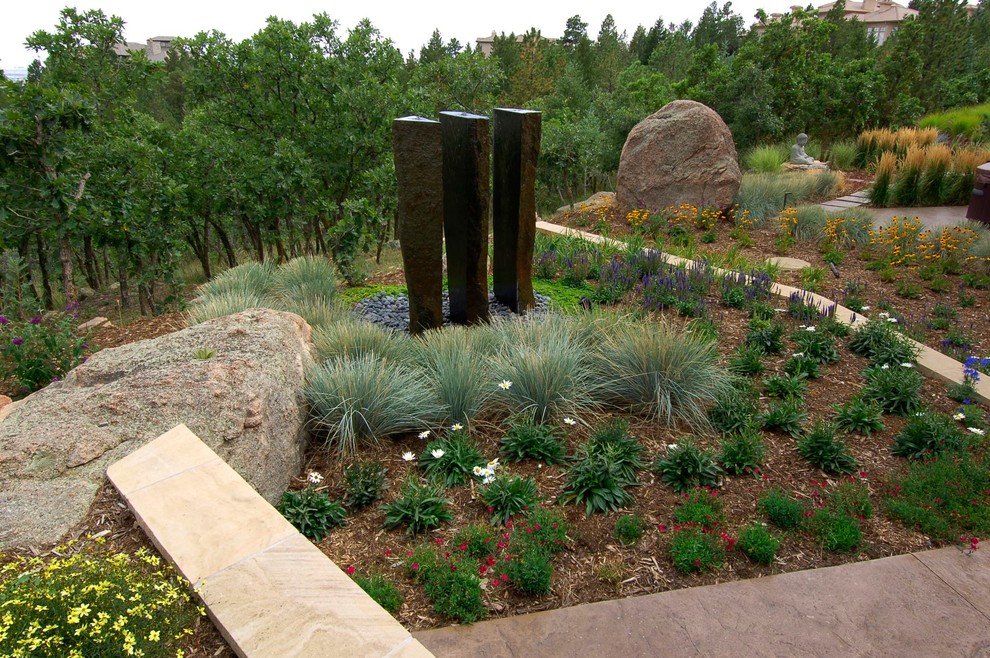 Photo of a contemporary garden in Denver with a water feature.