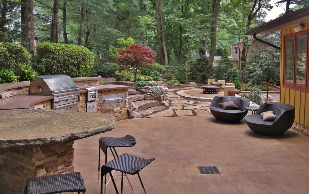Immagine di un patio o portico design di medie dimensioni e dietro casa con pavimentazioni in pietra naturale