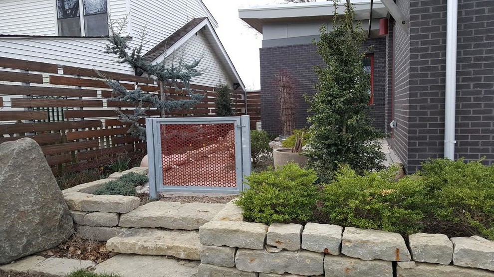 This is an example of a small contemporary landscaping in Kansas City.