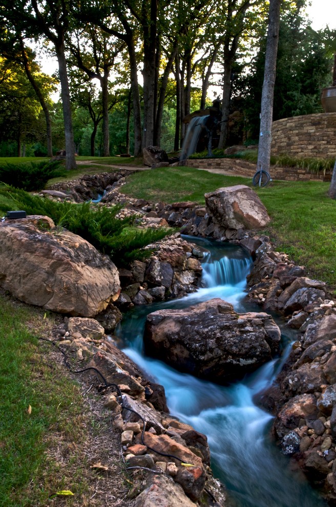 Photo of a huge rustic shade hillside water fountain landscape in Oklahoma City.