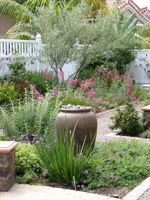 Design ideas for a medium sized shabby-chic style back full sun garden in San Diego with a garden path and gravel.