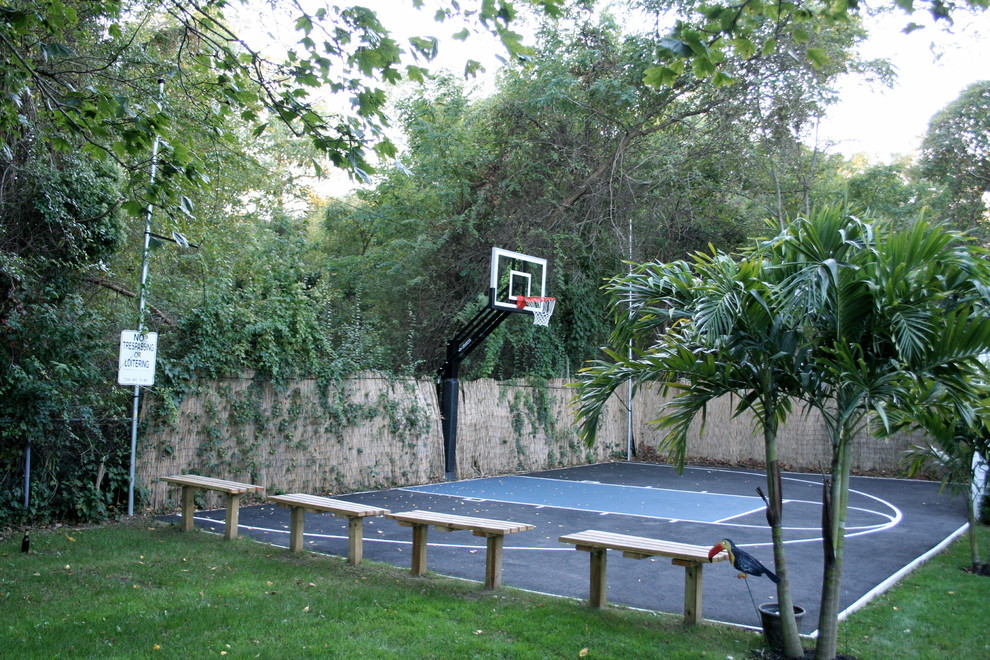 This is an example of a large traditional partial sun backyard decomposed granite outdoor sport court in New York.
