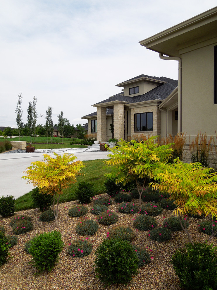 Design ideas for a medium sized contemporary front xeriscape garden in Omaha with a garden path and concrete paving.