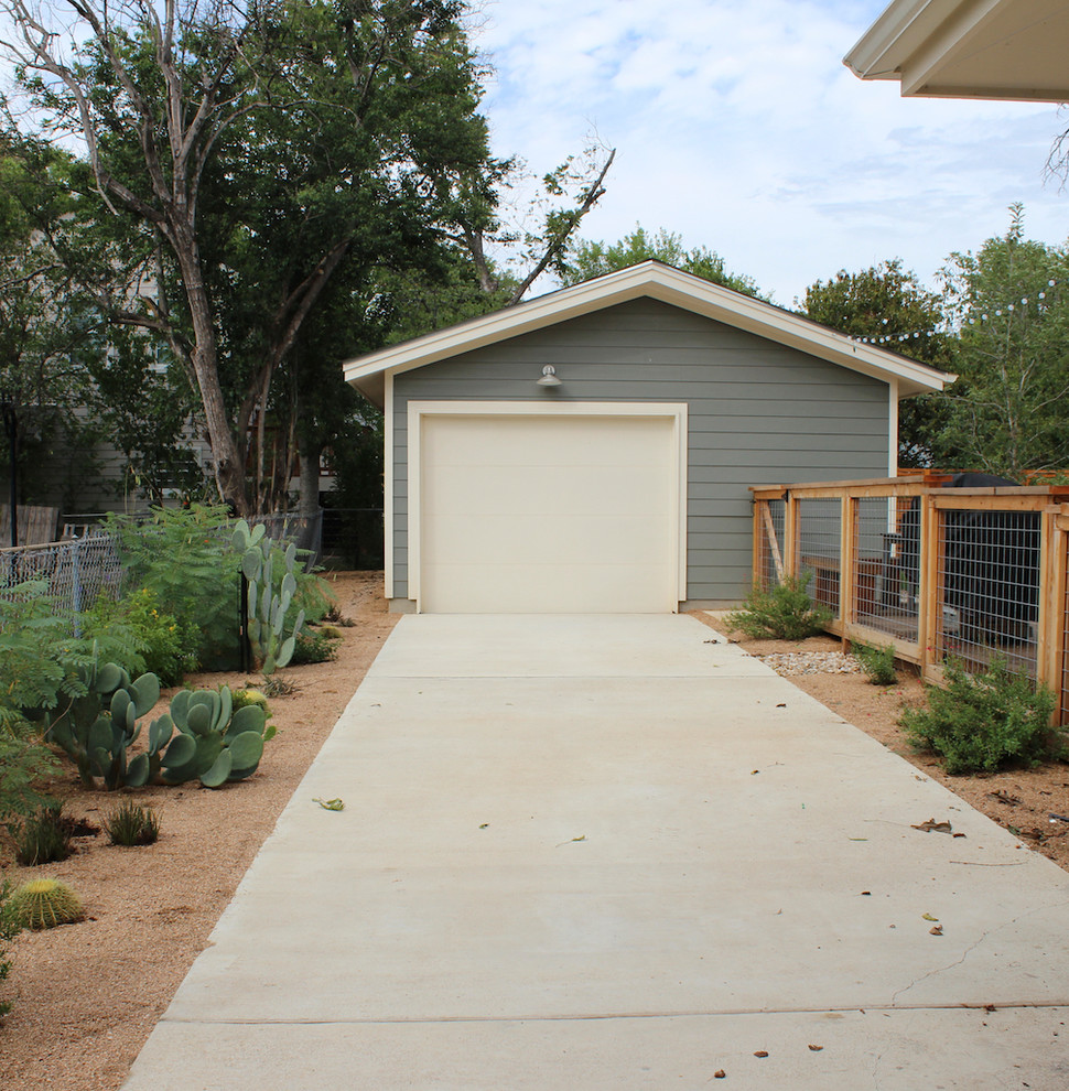 This is an example of a mid-sized modern drought-tolerant and partial sun front yard stone landscaping in Austin.
