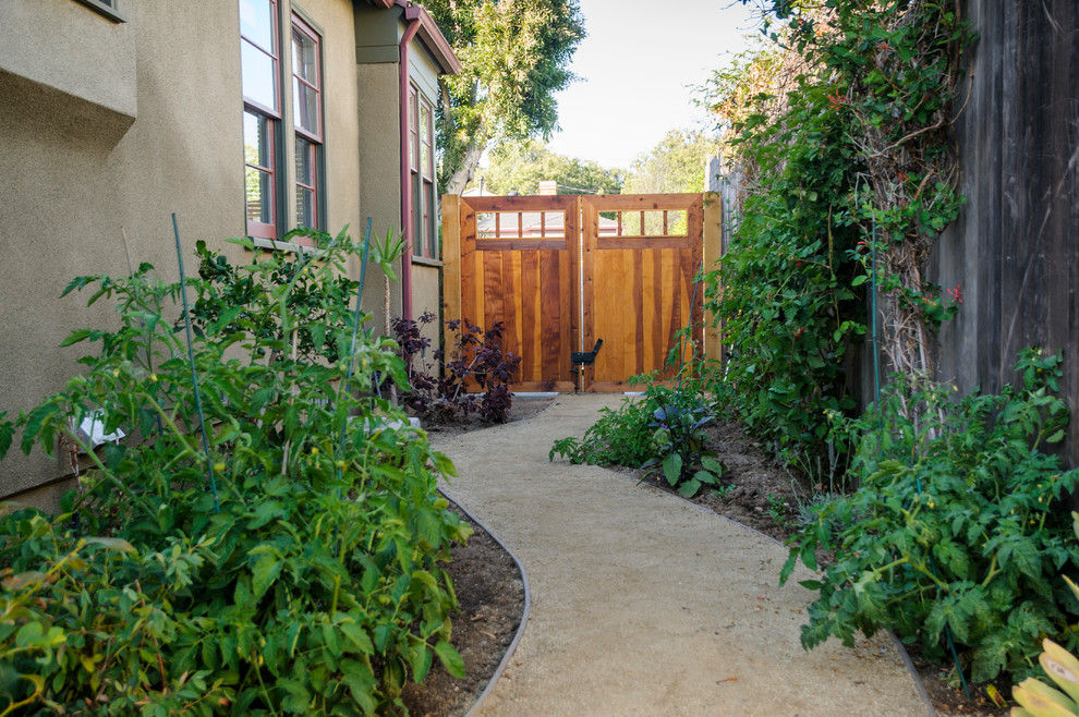 Inspiration for a medium sized traditional back formal partial sun garden for spring in Los Angeles with gravel and a vegetable patch.